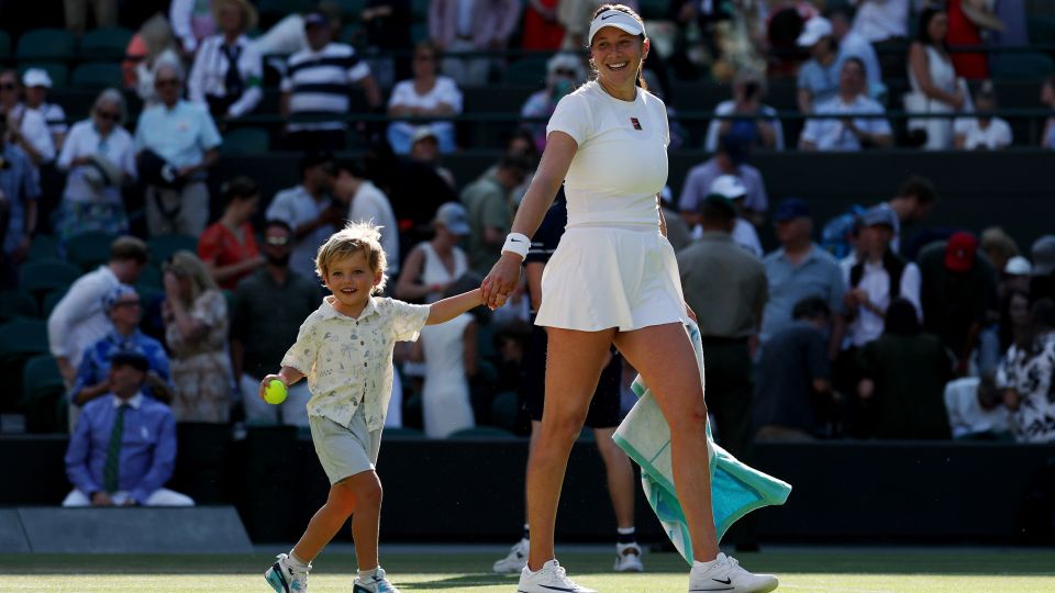 Anisimova celebrates with nephew Jaxon after her win against Pavlyuchenkova. - Ezra Shaw/Getty Images