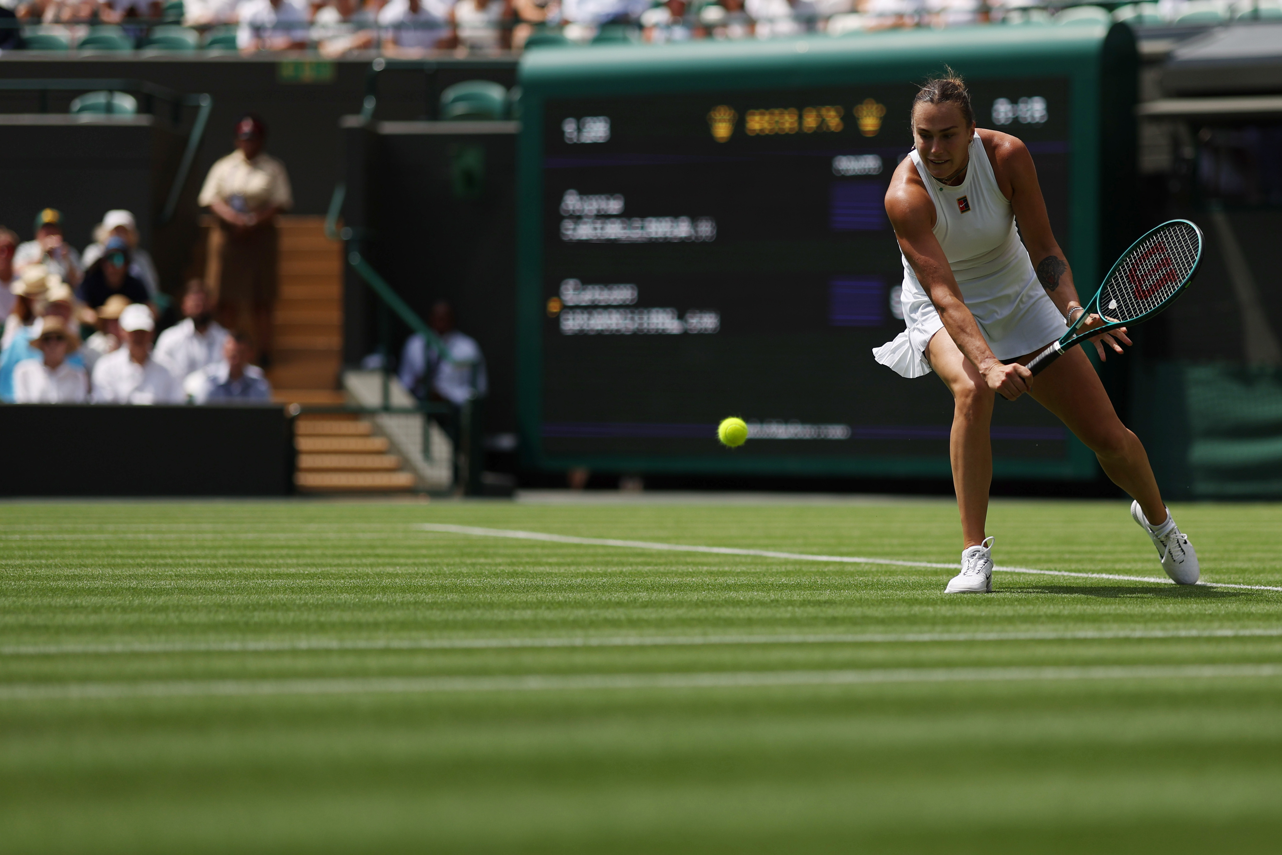 Jun 30, 2025; Wimbledon, United Kingdom; Aryna Sabalenka hits a backhand against Carson Branstine (CAN) (not pictured) on day one of The Championships, Wimbledon 2025 at All England Lawn Tennis and Croquet Club. Mandatory Credit: Geoff Burke-Imagn Images