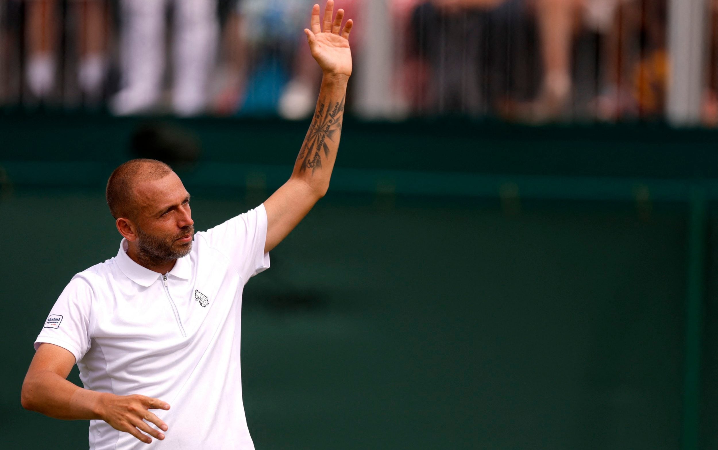 Dan Evans celebrates winning his first round match