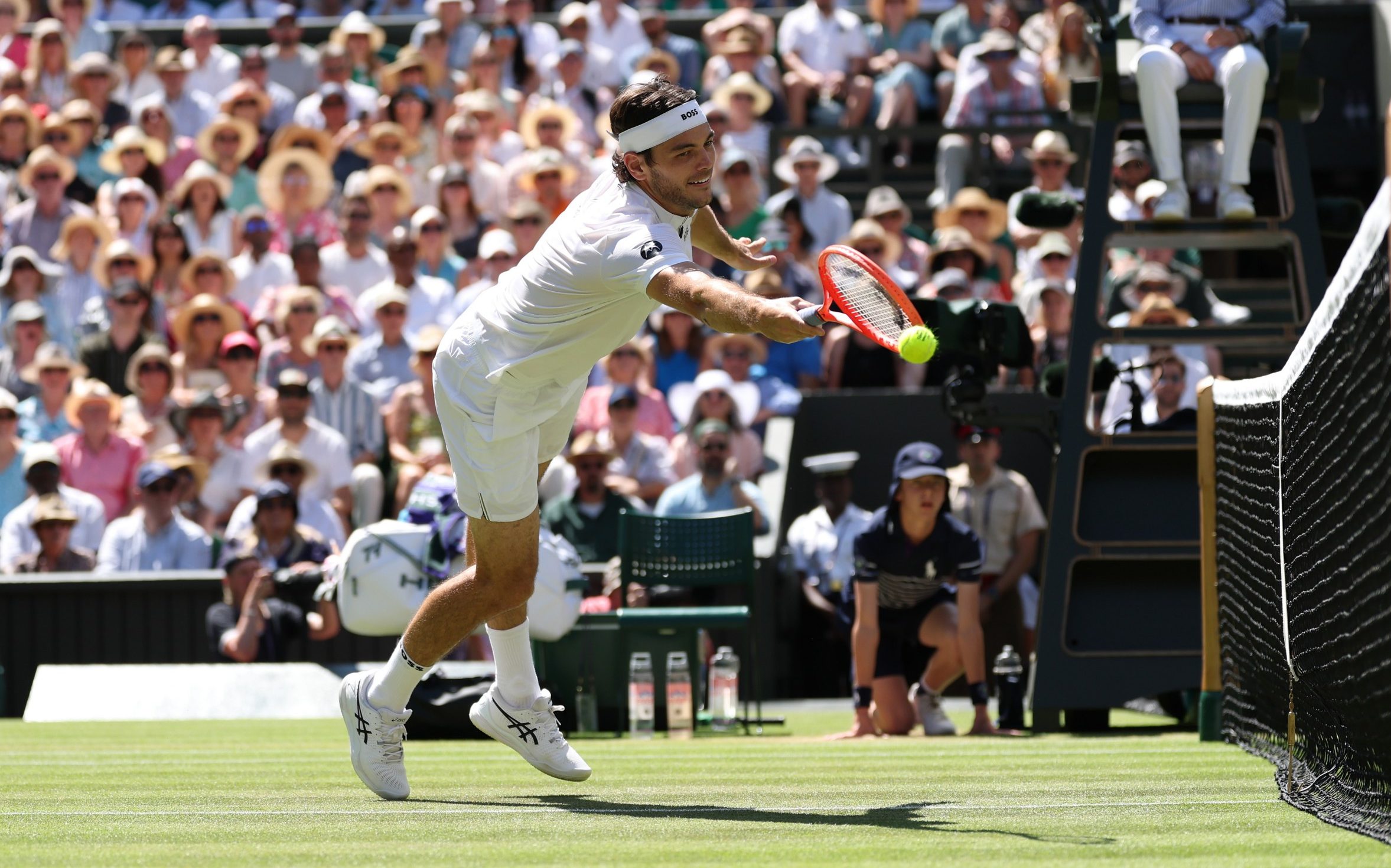 Taylor Fritz of United States reaches to play a forehand against Carlos Alcaraz