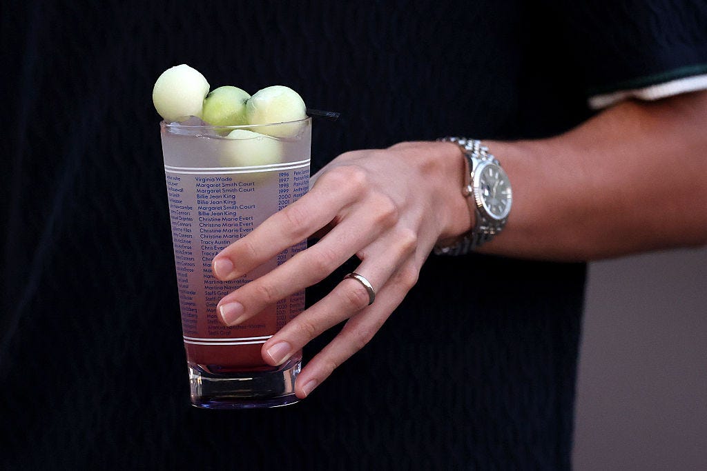 Fans walk the concourse while holding Honey Deuce cocktails during the 2025 US Open at USTA Billie Jean King National Tennis Center on Aug. 31, 2025 in Flushing, New York City.