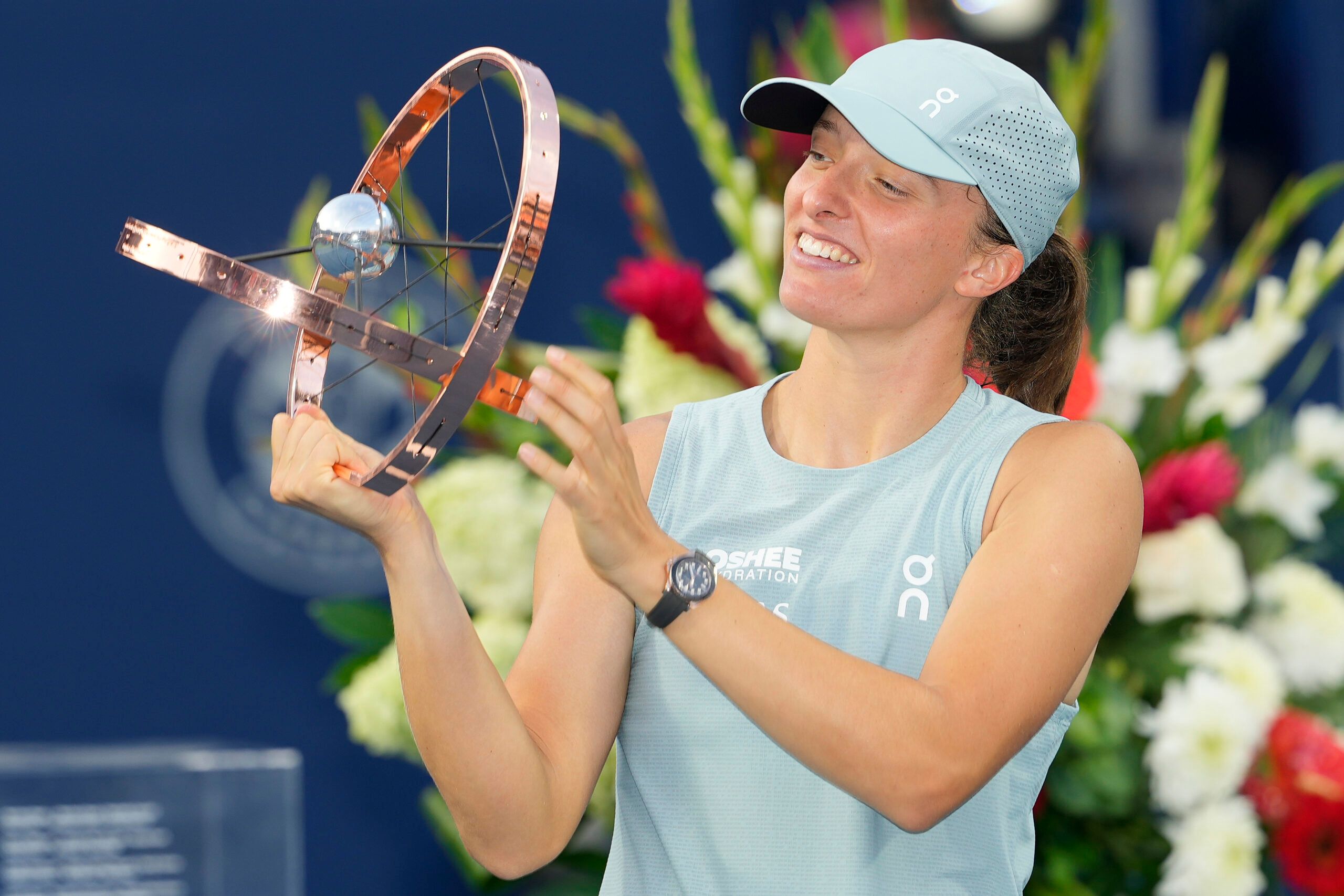 Aug 13, 2026; Toronto, Ontario, Canada; Iga Swiatek (POL) looks at the National Bank Open trophy after defeating Elena Rybakina (not pictured) during the National Bank Open final at Sobeys Stadium. © John E. Sokolowski-Imagn Images
