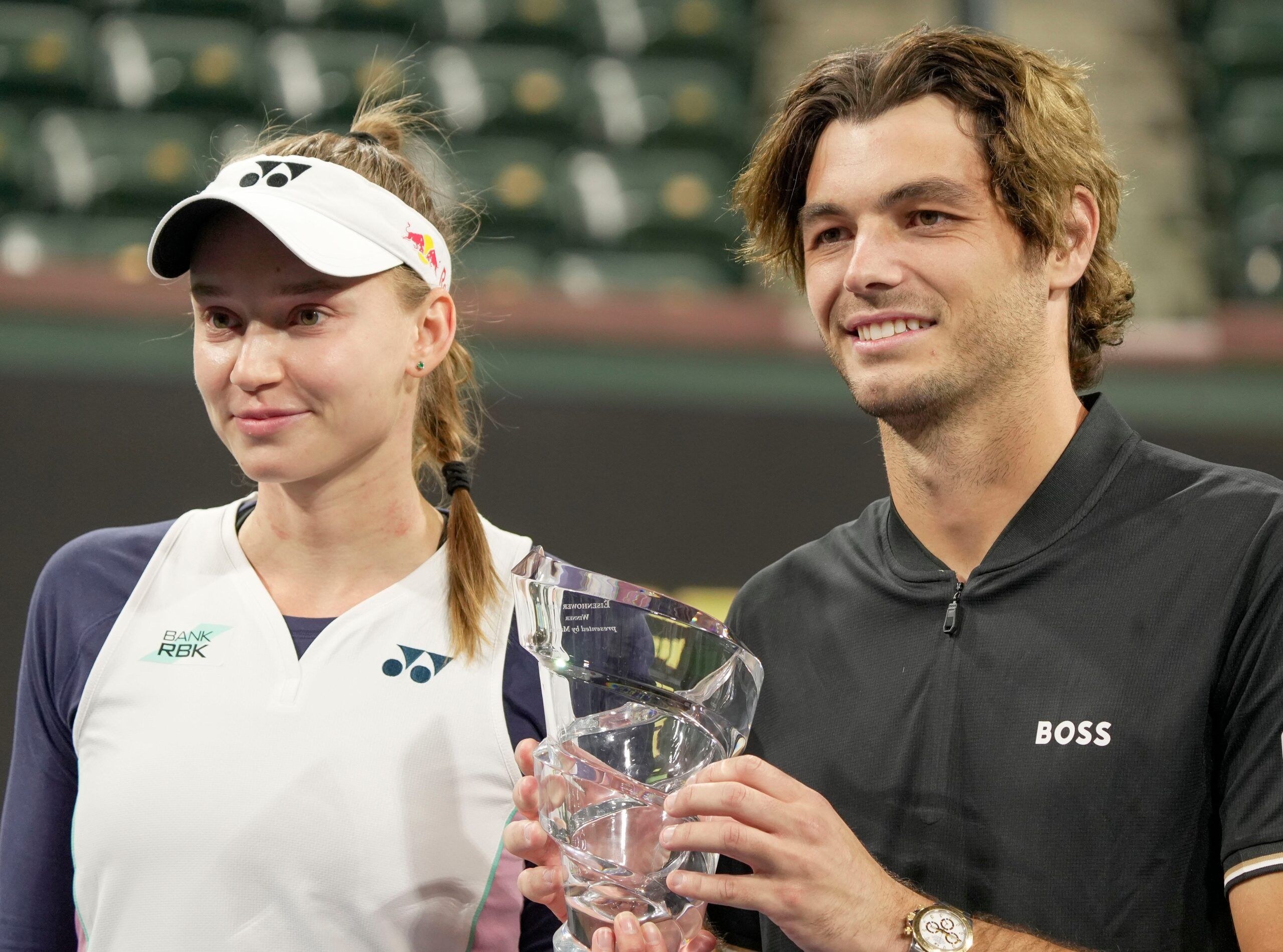 Elena Rybakina, left, and Taylor Fritz hold the trophy after winning the Eisenhower Cup Tie Break Tens during the BNP Paribas Open in Indian Wells, Calif., March 4, 2025.