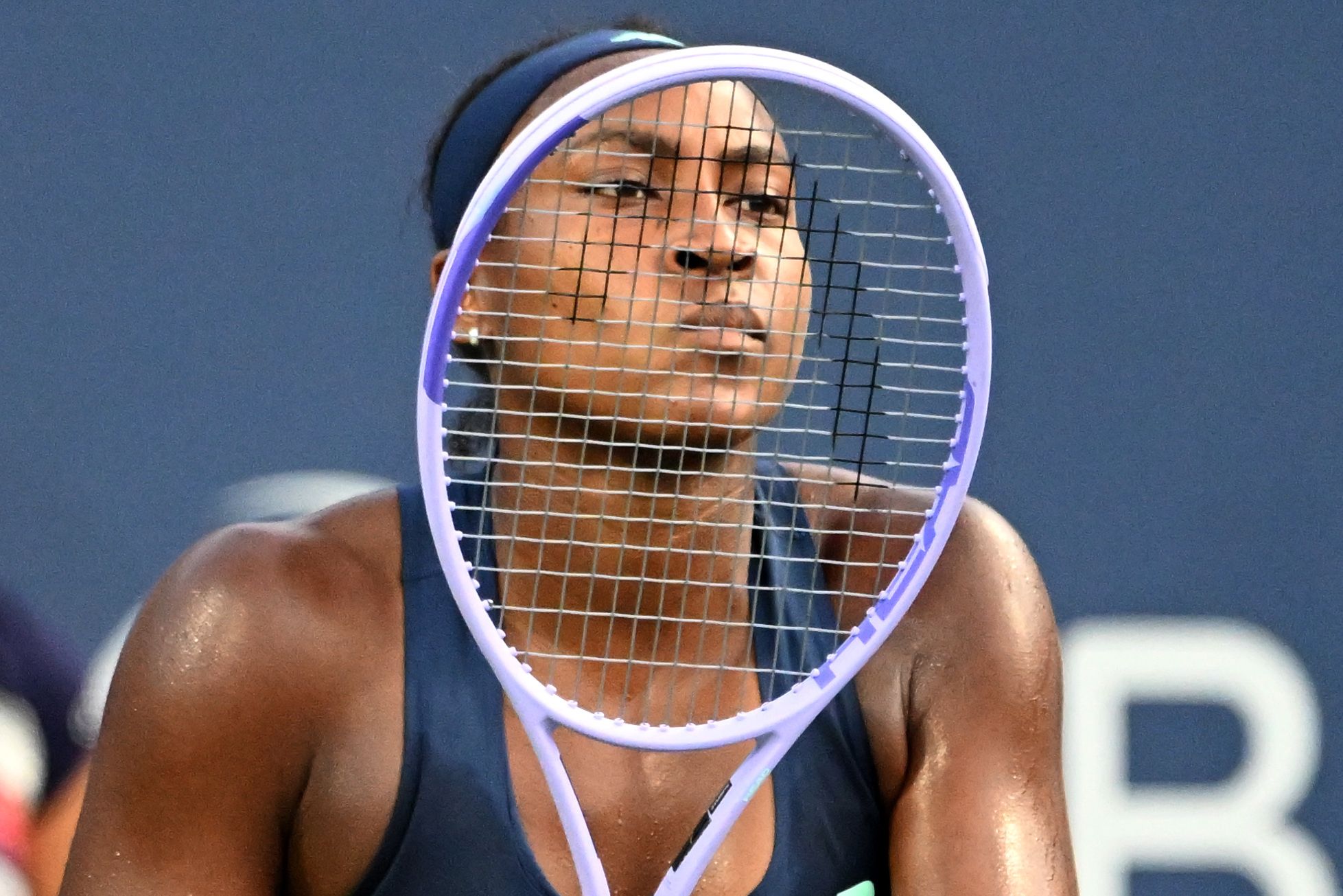 Aug 7, 2026; Toronto, Ontario, Canada; Coco Gauff (USA) looks through the strings of her racquet as she waits to receive serve from Maria Sakkari (GRE) during third round play at Sobeys Stadium. © Dan Hamilton-Imagn Images