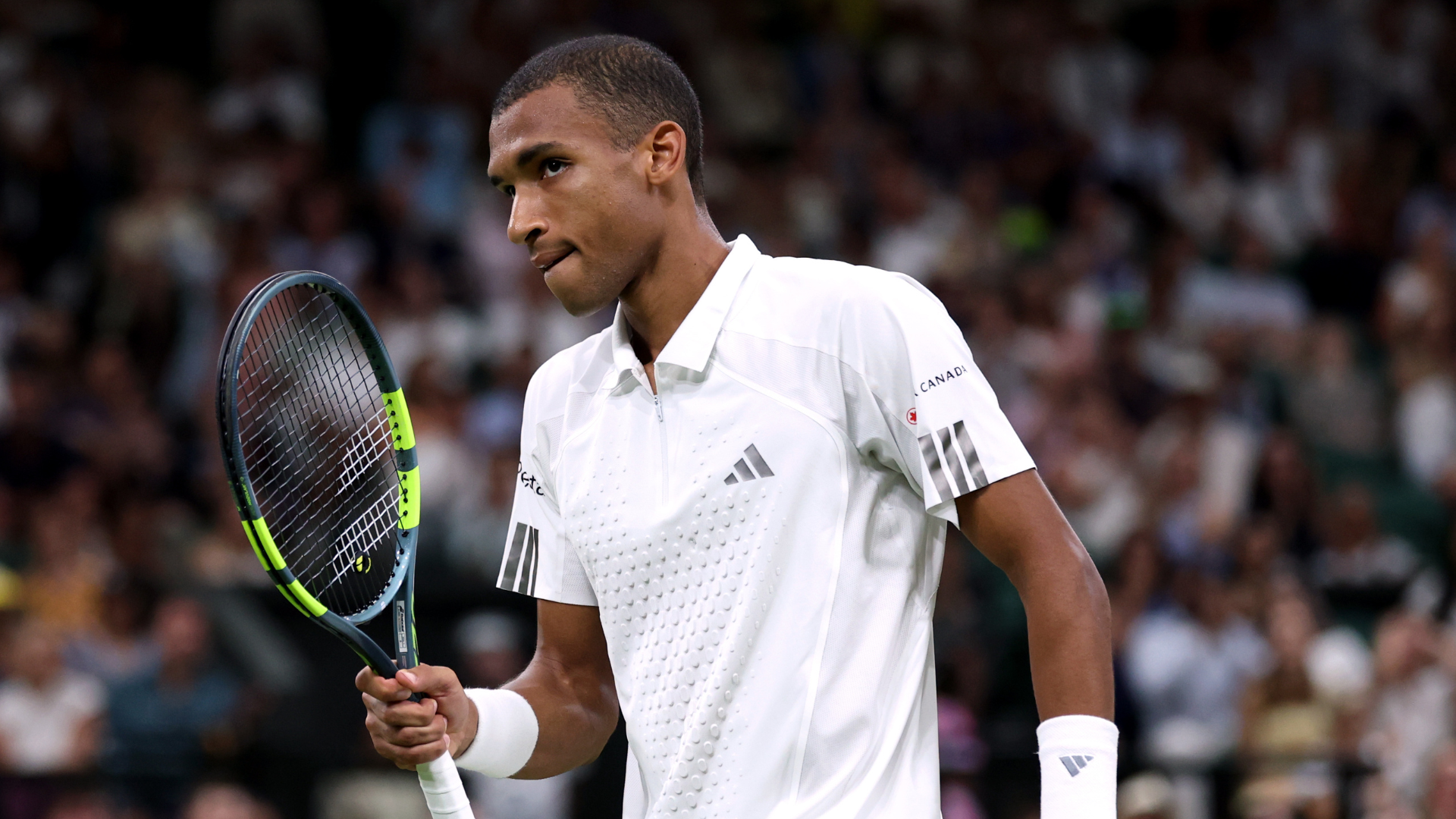 LONDON, ENGLAND - JULY 07: Felix Auger-Aliassime of Canada reacts against Novak Djokovic of Serbia during their Gentlemen's Singles quarterfinal match on day nine of The Championships Wimbledon 2026 at All England Lawn Tennis and Croquet Club on July 07, 2026 in London, England. (Photo by Cameron Spencer/Getty Images)