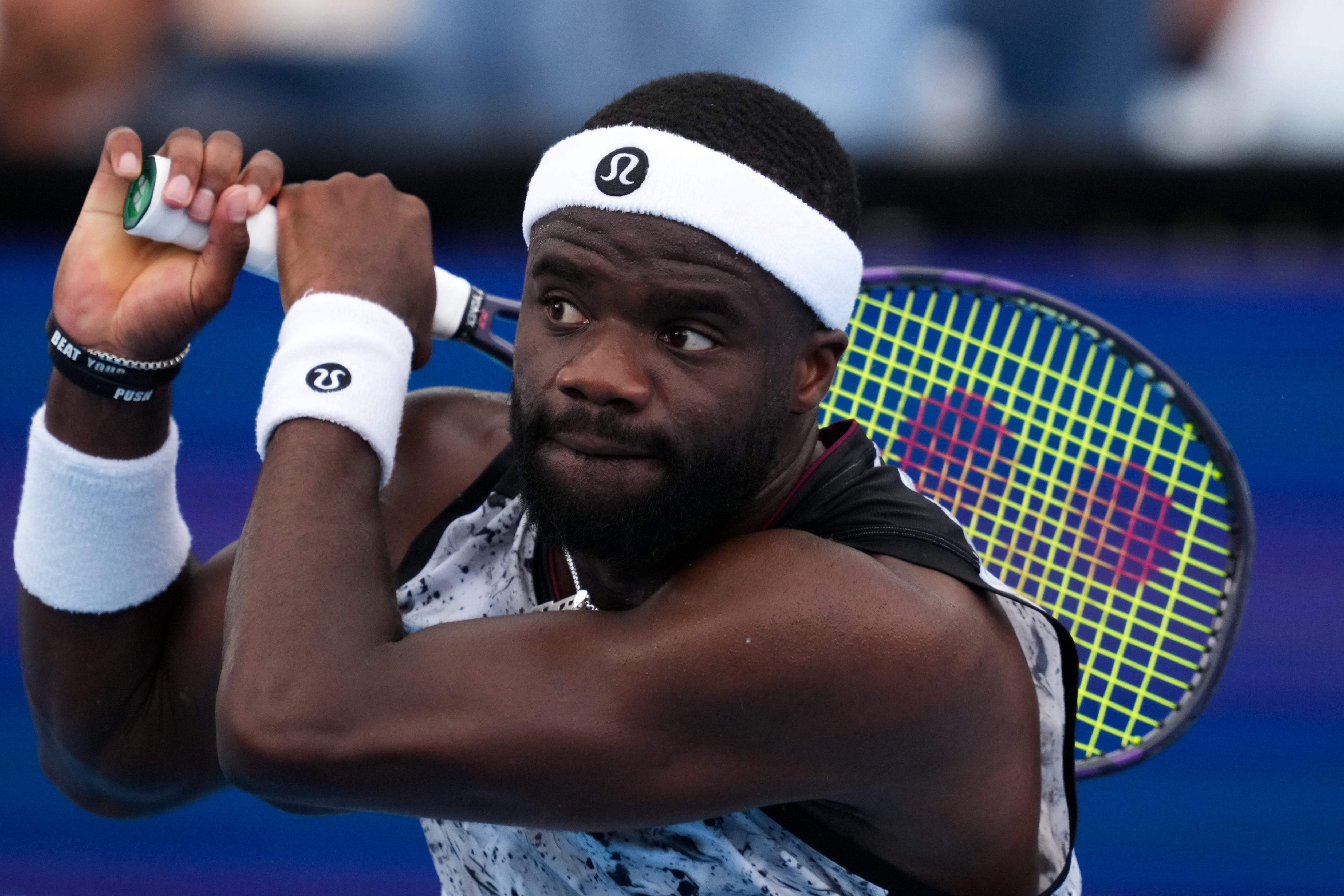 Frances Tiafoe returns a shot against Arthur Fils during the Cincinnati Open at Lindner Family Tennis Center.