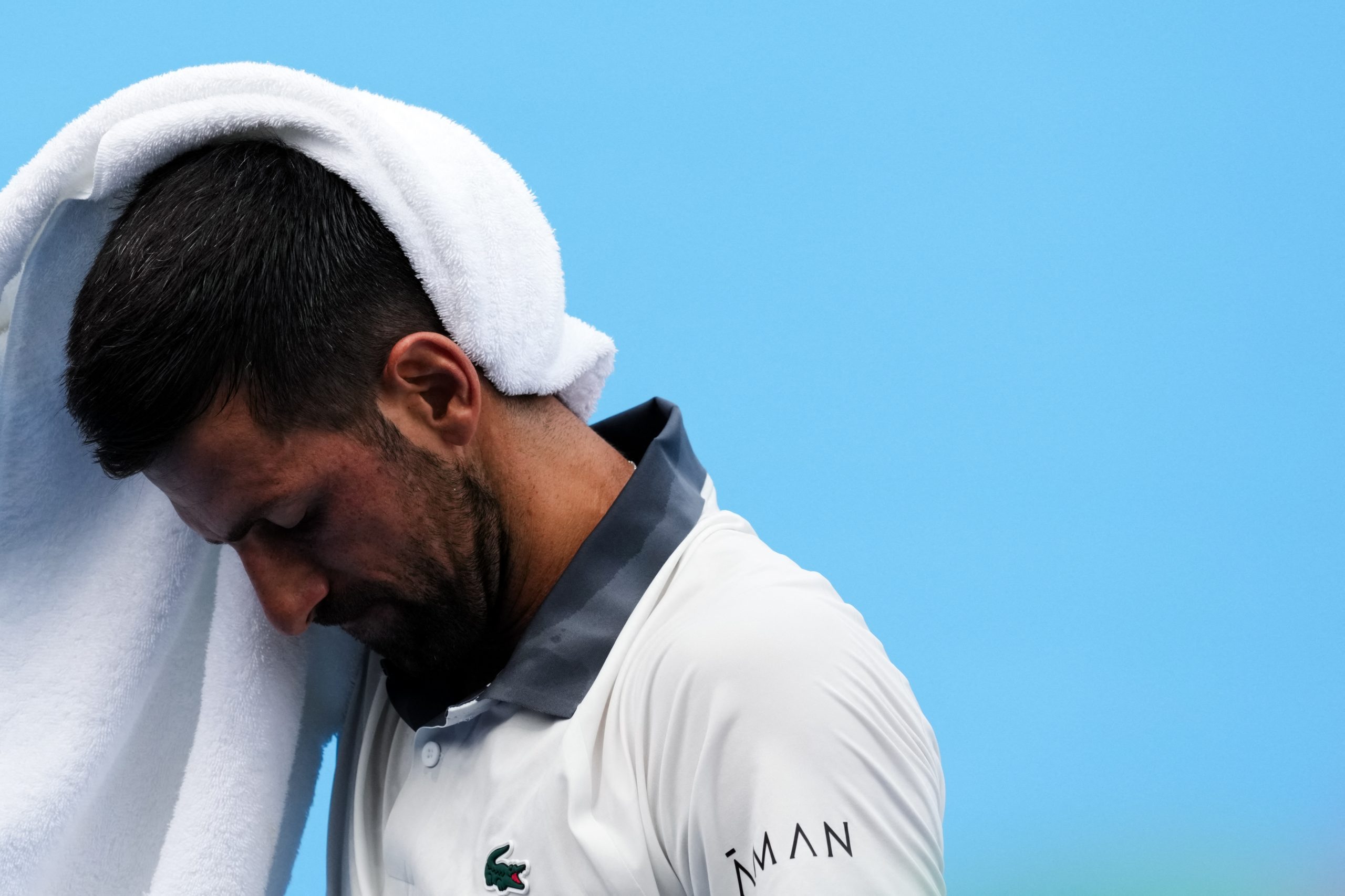 Aug 15, 2026; Mason, OH, USA; Novak Djokovic (SRB) wipes his head after a point against Thiago Agustín Tirante (ARG) during the Cincinnati Open at Lindner Family Tennis Center. © Aaron Doster-Imagn Images