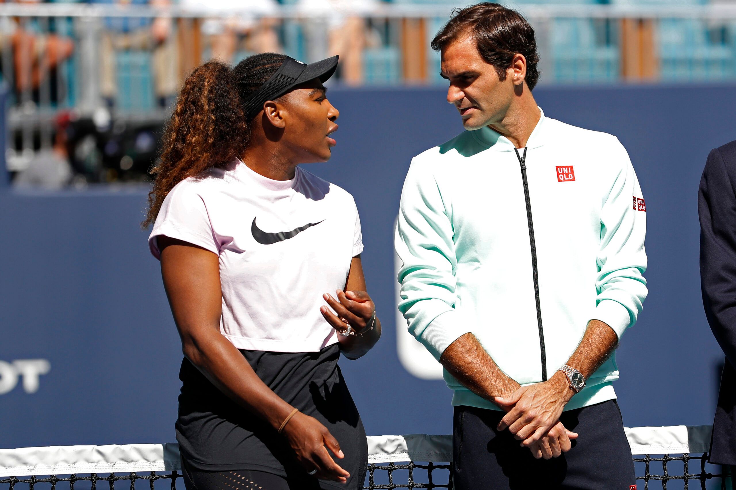 Mar 20, 2019; Miami Gardens, FL, USA; Serena Williams of the United States (L) speaks with Roger Federer of Switzerland (R) during a ribbon cutting ceremony on new stadium court at Hard Rock Stadium prior to play in the first round of the Miami Open at Miami Open Tennis Complex. © Geoff Burke-USA TODAY Sports