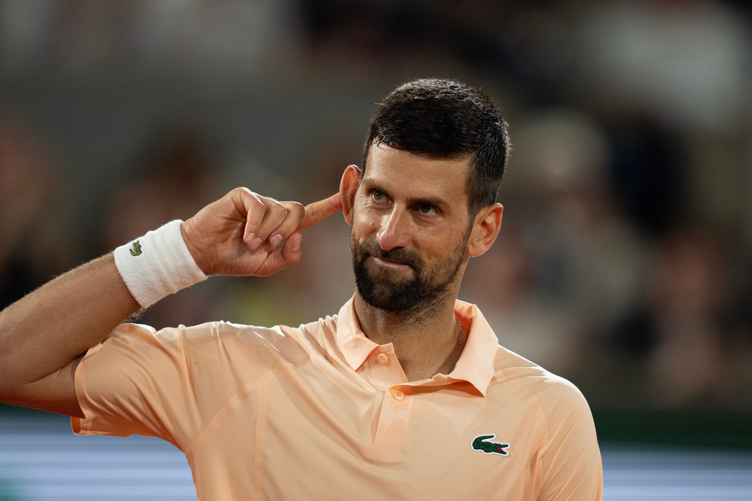 May 24, 2026; Paris, France; Novak Djokovic of Serbia reacts during his first round match against Giovanni Mpetshi Perricard of France on day one at Stade Roland Garros. © Susan Mullane-Imagn Images