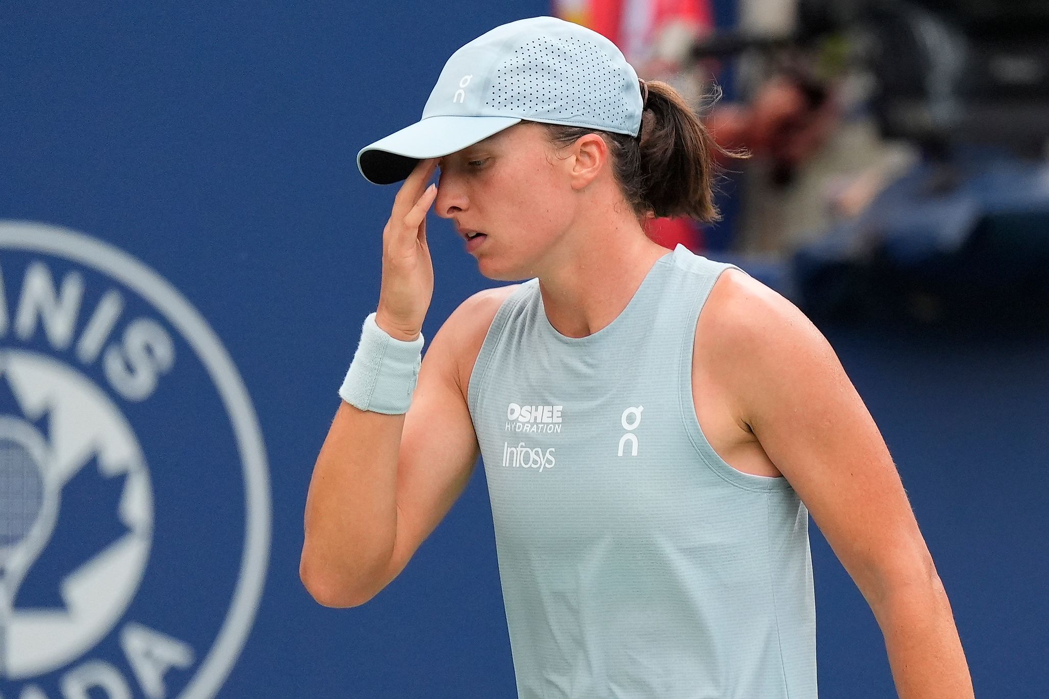 Aug 8, 2026; Toronto, Ontario, Canada; Iga Swiatek (POL) reaxcts after losing a pointl to Marta Kostyuk (not pictured) during the fourth round at the National Bank Open at Sobeys Stadium. © John E. Sokolowski-Imagn Images