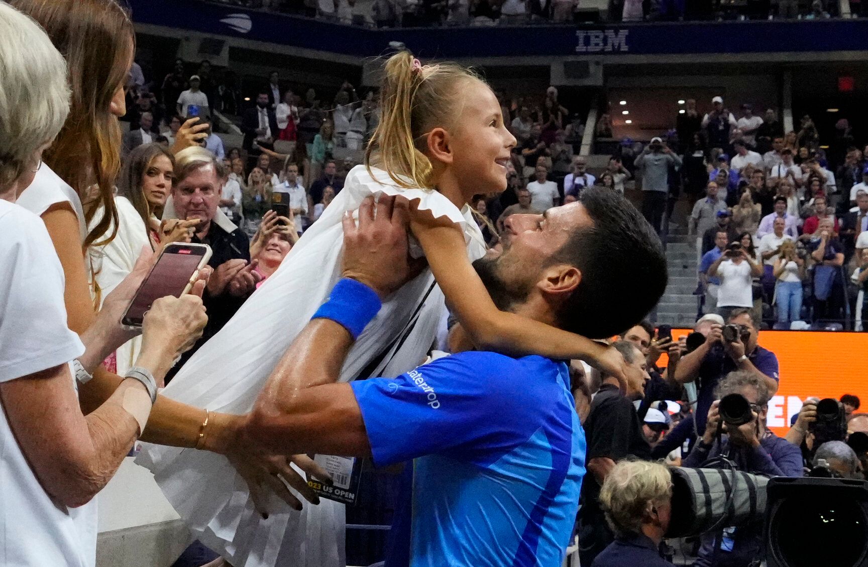 Sep 10, 2023; Flushing, NY, USA; Novak Djokovic of Serbia celebrates with his daughter Tara after his match against Daniil Medvedev (not pictured) in the men's singles final on day fourteen of the 2023 U.S. Open tennis tournament at USTA Billie Jean King National Tennis Center. © Robert Deutsch-USA TODAY Sports