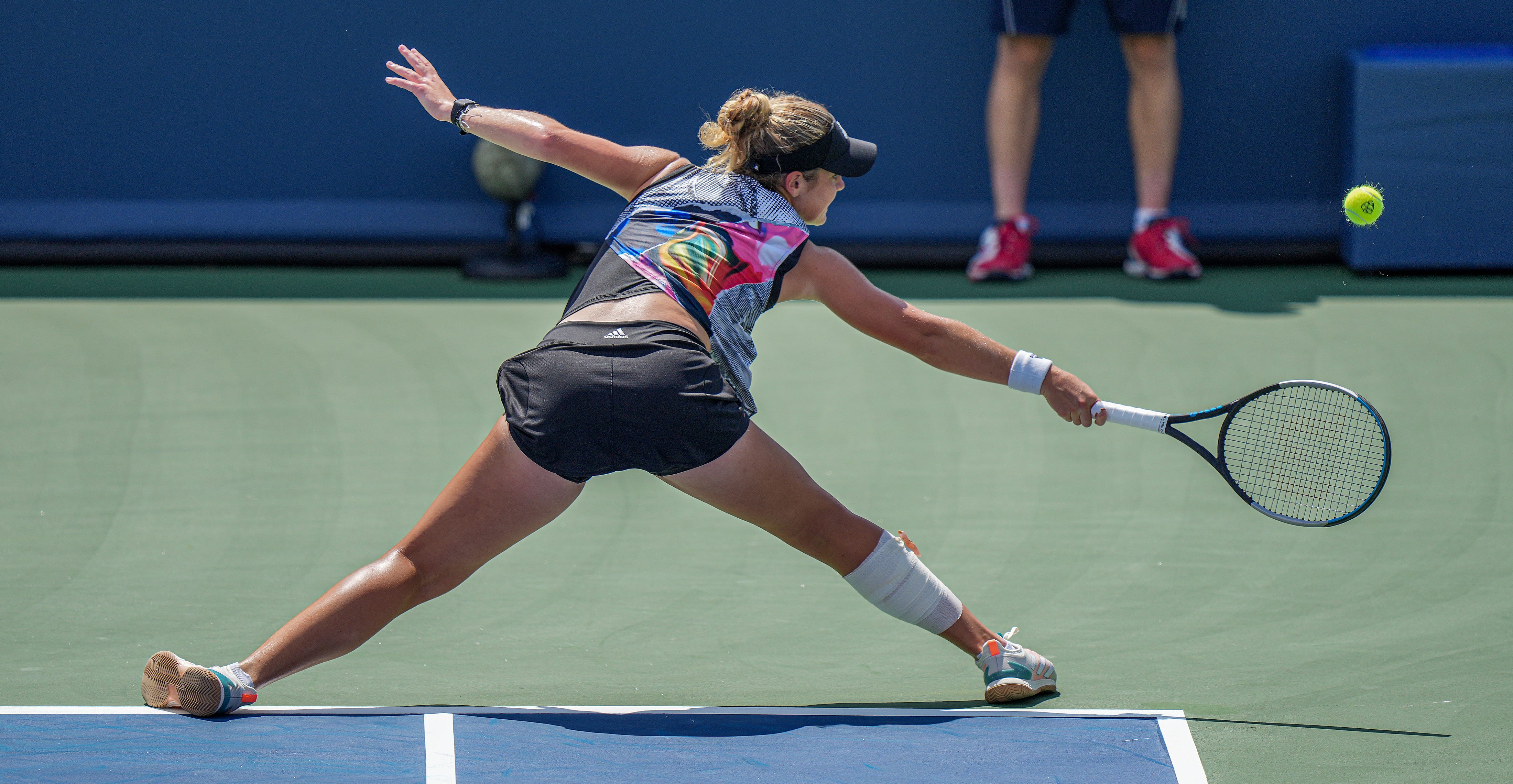 Caty McNally a native of Madeira makes a hit to her opponent, Ons Jabeur of Tunisia during the Western & Southern Open at Grand Stand court at the Lindner Family Tennis Center in Mason Wednesday, August 17, 2022. McNally lost 3-6, 6-4, 6(7)-7.