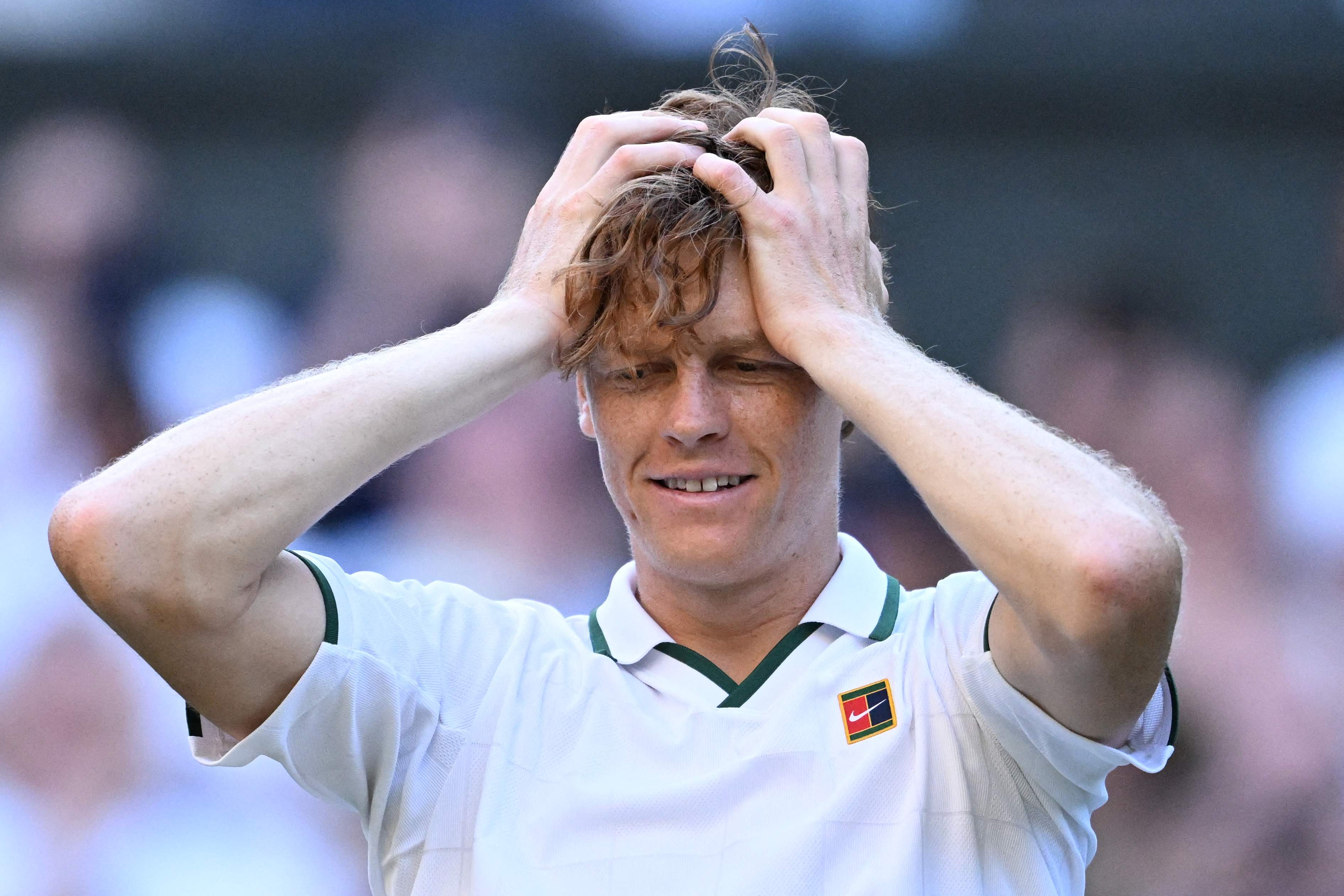 Italy's Jannik Sinner reacts to beating Germany's Alexander Zverev during their men's singles final tennis match on the fourteenth day of the 2026 Wimbledon Championships at The All England Lawn Tennis and Croquet Club in Wimbledon, southwest London, on July 12, 2026. (Photo by Kirill KUDRYAVTSEV / AFP via Getty Images) / RESTRICTED TO EDITORIAL USE