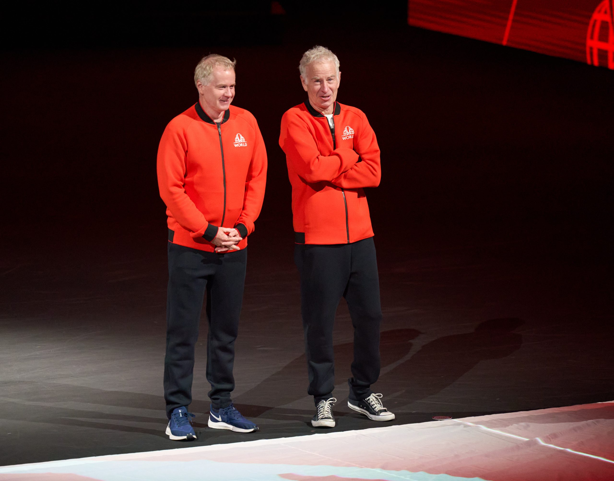 Sep 23, 2022; London, United Kingdom; Team World captains Patrick and John McEnroe open the evening session of the Laver Cup tennis matches © Peter van den Berg-USA TODAY Sports