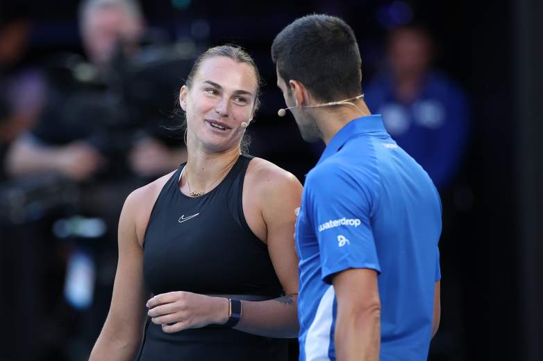 MELBOURNE, AUSTRALIA - JANUARY 11: Aryna Sabalenka and Novak Djokovic react during a charity match ahead of the 2024 Australian Open at Melbourne Park on January 11, 2024 in Melbourne, Australia. (Photo by Kelly Defina/Getty Images)