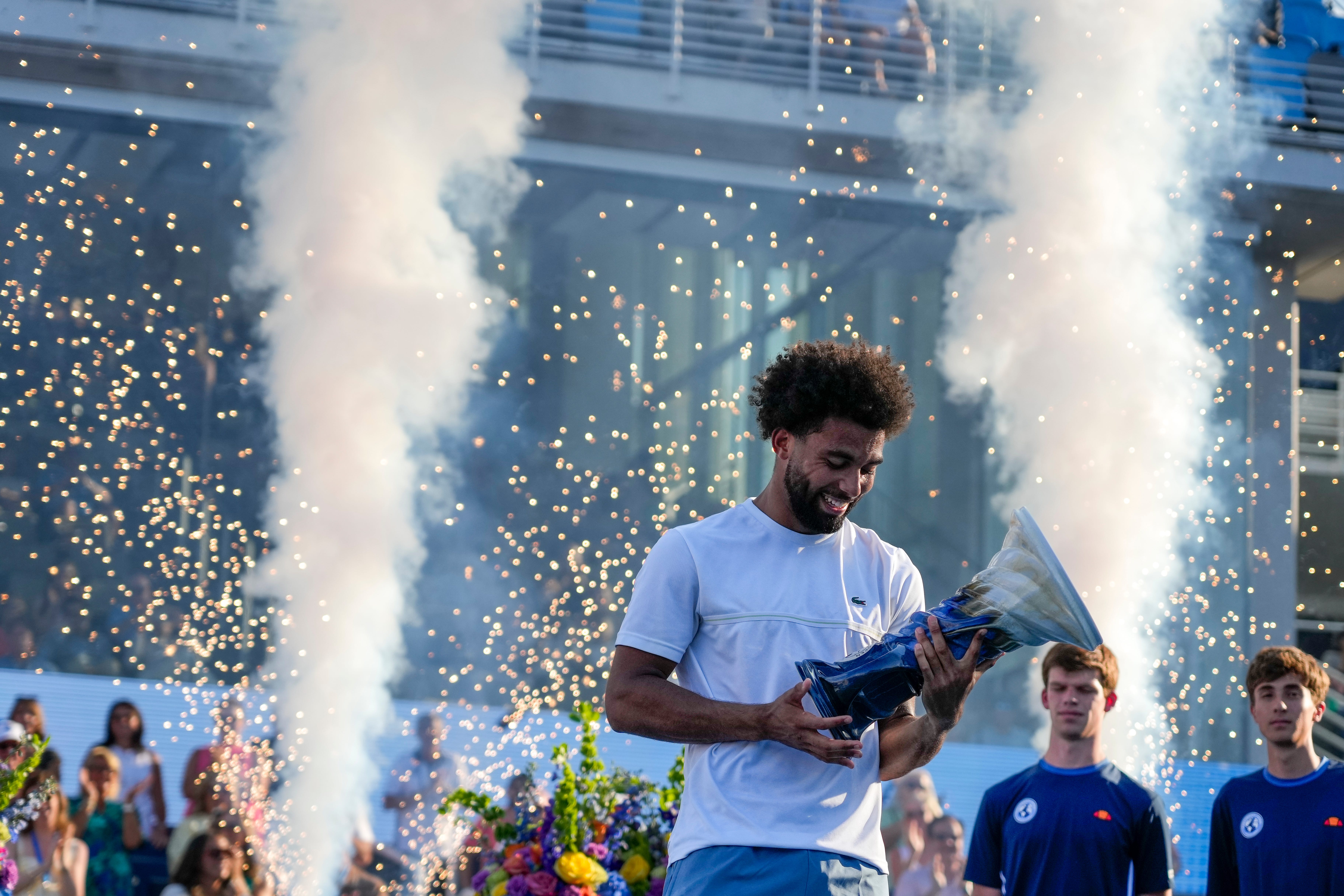 Arthur Fils raises the Rookwood Cup during the trophy ceremony after the Cincinnati Open Finals match between Arthur Fils, of France, and Frances Tiafoe, of the United States, at the Lindner Family Tennis Center in Mason, Ohio, on Sunday, Aug. 23, 2026. Fils won the championship, 6-3, 1-6, 6-0.