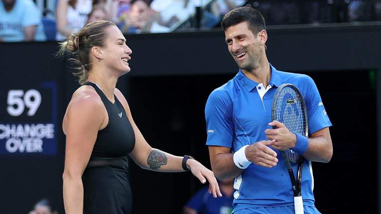 MELBOURNE, AUSTRALIA - JANUARY 11: Novak Djokovic and Aryna Sabalenka react during a charity match ahead of the 2024 Australian Open at Melbourne Park on January 11, 2024 in Melbourne, Australia. (Photo by Kelly Defina/Getty Images)