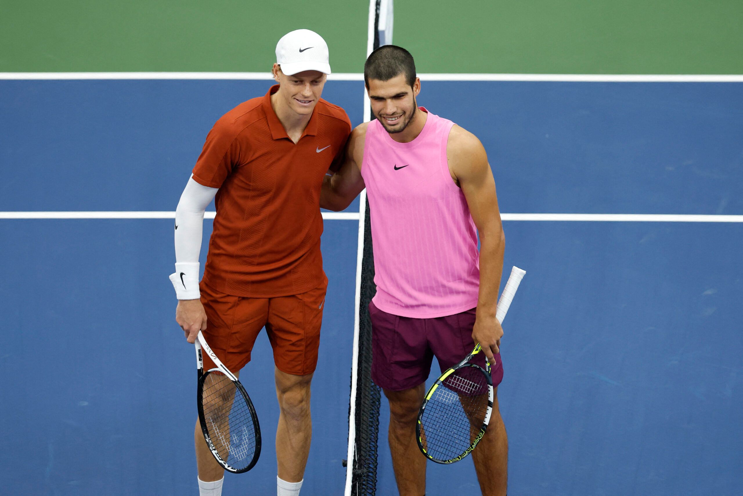 Sep 7, 2025; Flushing, NY, USA; Jannik Sinner (ITA) and Carlos Alcaraz (ESP) pose for a photo at the net prior to the final of mens singles at Billie Jean King National Tennis Center. © Geoff Burke-Imagn Images