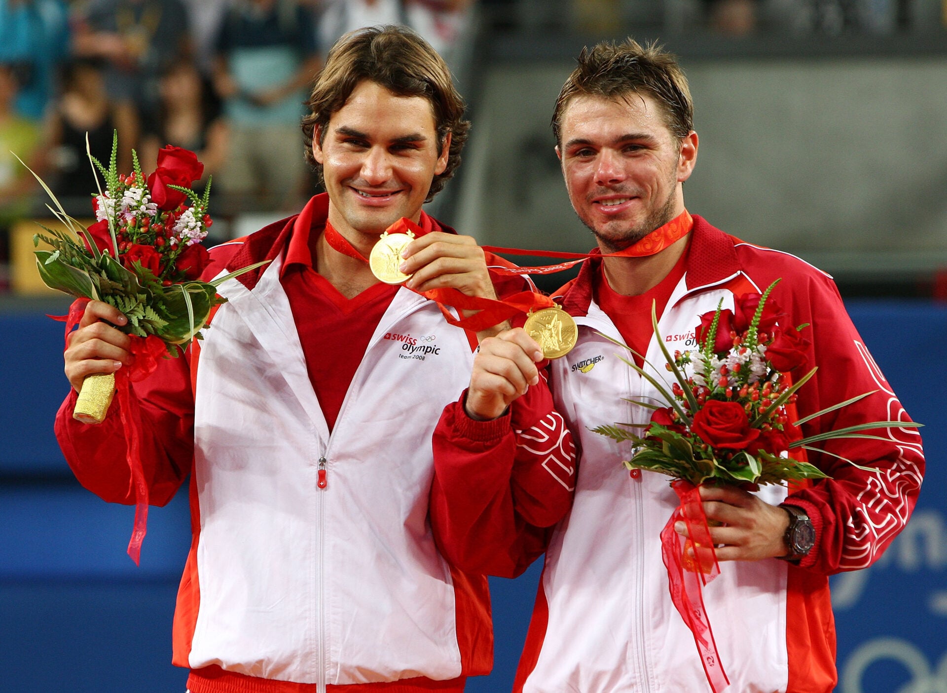 Roger Federer (left) and Stanislas Wawrinka of Switzerland receive their gold medals after defeating Thomas Johansson and Simon Aspelin of Sweden during the men's doubles gold medal tennis match at the Olympic Green Tennis Center on Day 8 of the Beijing 2008 Olympic Games on August 16, 2008 in Beijing, China.