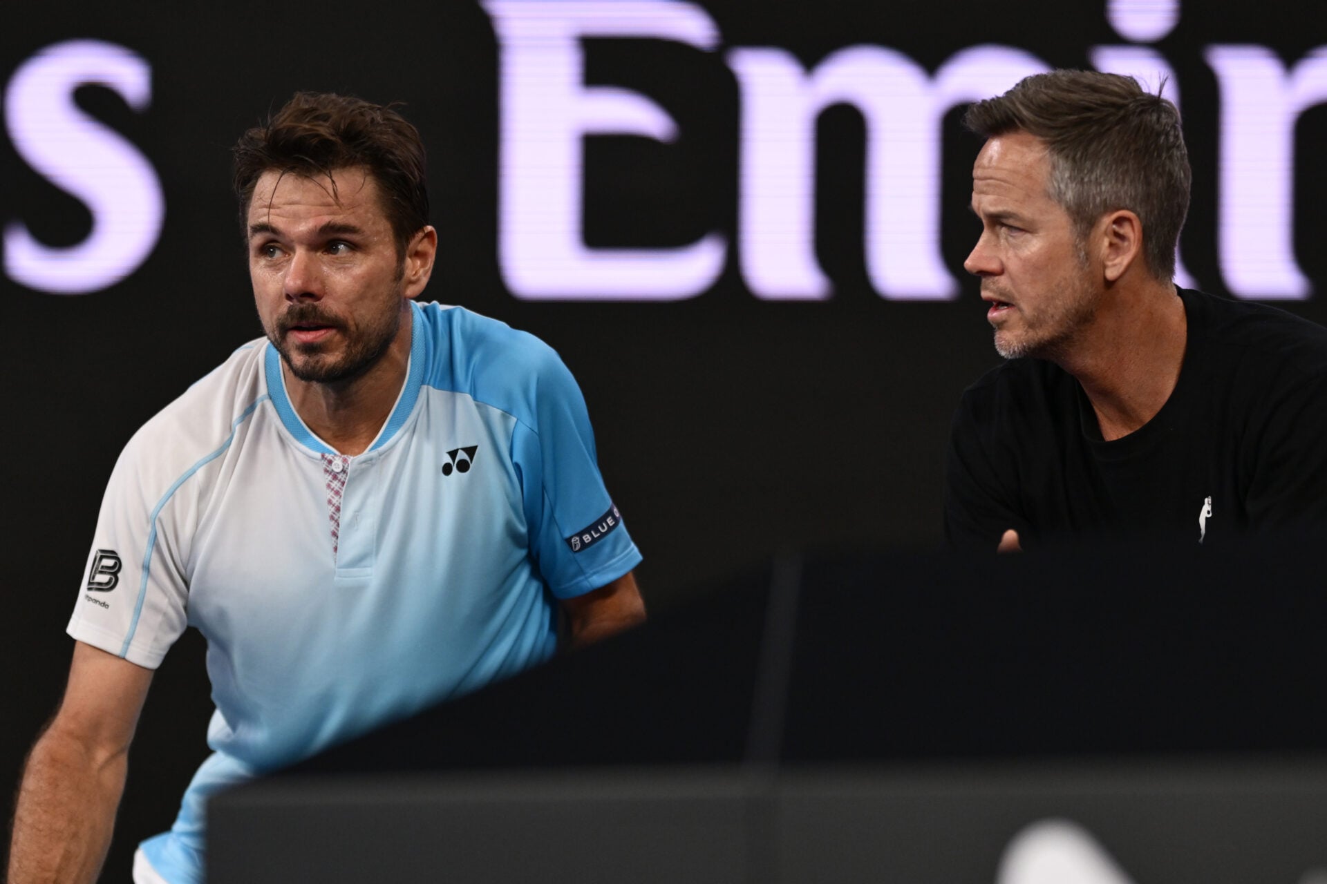 Stan Wawrinka (L) of Switzerland talks with his coach Magnus Norman (R) in the Men's Singles Third Round against Taylor Fritz of the United States during day seven of the 2026 Australian Open at Melbourne Park on January 24, 2026 in Melbourne, Australia.